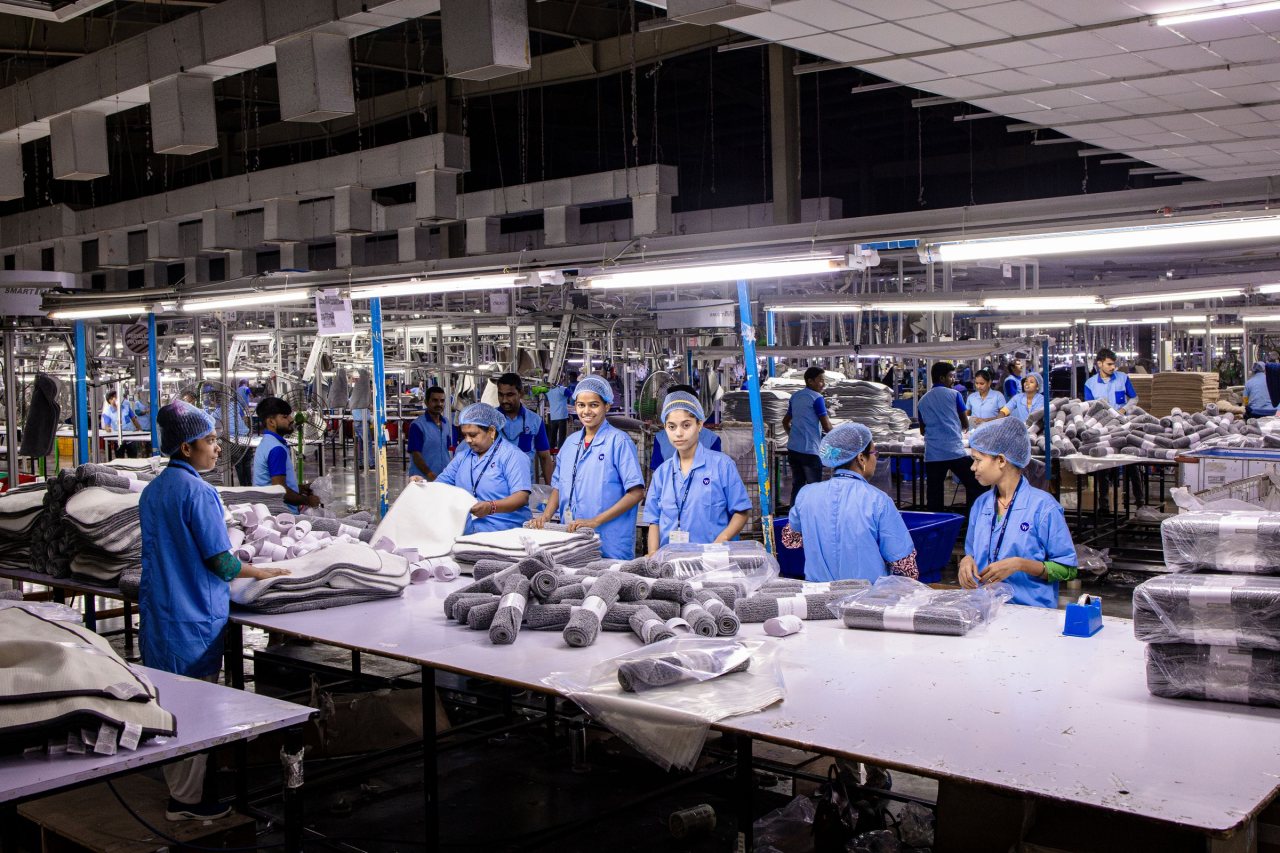 Workers on a busy Indian manufacturing production line